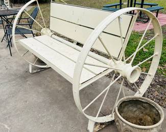 Bench made from wagon wheels and axle.  Love.
