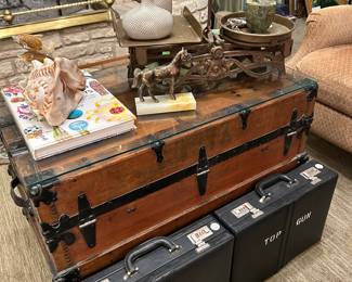 Antique shipping trunks.  Briefcases from TOP GUN.