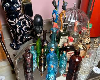 Tiny bottles of every shape and size.