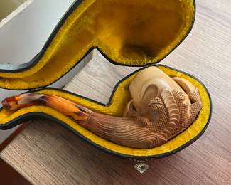 Eagle claw smoked pipe.