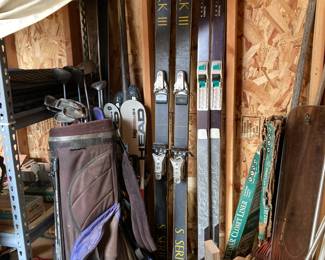 Skis, golf clubs and bag