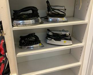 Vintage irons....one newer, sewing items