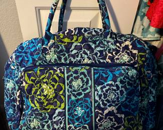 Several pieces of Vera Bradley purses and luggage