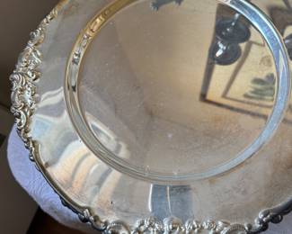 Two sets of silver plate chargers