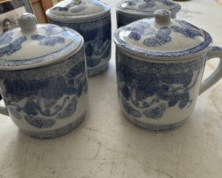 Blue and white lidded mugs