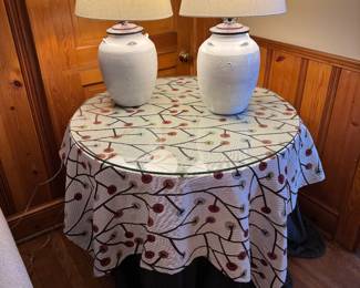 Deal table with glass top; pair of ceramic lamps