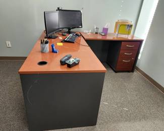 L-shaped desk, filing cabinet, monitor, office supplies