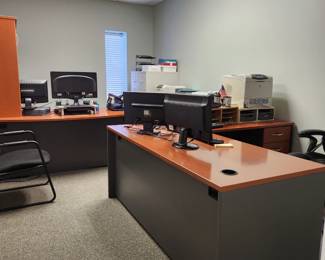 L-shaped desks - one has a hutch that sits directly on the L-shaped desk