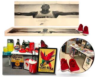 Den & Bar  Décor’s abundant sports memorabilia, includes a signed Ditka artwork, and this terrific iconic  "Wings" poster featuring Chicago Bulls basketball legend Michael Jordan along with quote from poet William Blake,  “No bird soars too high if he soars with his own wings"; also offered are a pair of size 17 fire engine red Nikes; poster dimensions about 22”H x 61"W
