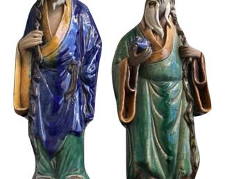 Chinese mudmen; one holding a staff and the other holding a peach, an icon of longevity; 14” H