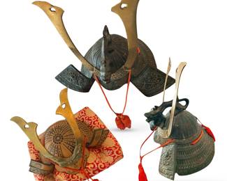 Two Samurai helmets; helmet lower left for child; dragon helmet at top for adult; lower right photo shows side of top helmet with clearer view of dragon; each helmet comes with red and gold display pillow