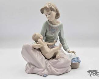 2266  Lladro Dressing the Baby Porcelain Sculpture
