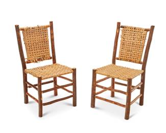 1468
Mid-20th century
A pair of rustic caned hickory side chairs
The natural wood chairs with caned back and seat, legs joined by a lower box stretcher and another anterior and two medial stretchers, 2 pieces
Each: 36" H x 18.5" W x 21" D
Estimate: $100 - $200