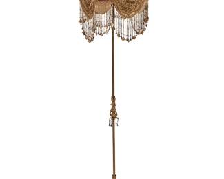 1495
Early 20th century
A Victorian-style floor lamp and embroidered and beaded shade
The single-light lamp with patinated metal alloy standard and base, featuring an embroidered shade with beaded fringe depicting avian and floral motifs, electrified
Overall: 69" H x 17" Dia.
Estimate: $400 - $600