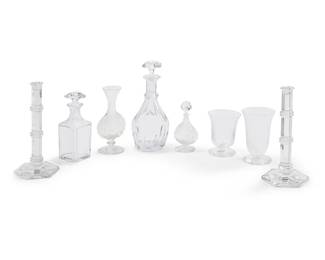 1340
Mid/late 20th century
A group of Baccarat glass table items
Six with Baccarat stencil mark; candlesticks etched to underside: Tiffany & Co.
The molded glass items, comprising two "Harcourt" decanters, a "Primevere" bud vase and perfume bottle, and two "Erna" footed vases with etched scrollwork, together with a pair of Tiffany & Co. clear glass "Windham" candlesticks, 8 pieces
Tallest: 11.625" H x 4.875" Dia.; Shortest: 6.5" H x 3.25" W x 2.625" D
Estimate: $300 - $500
