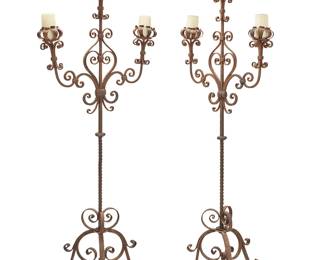 1473
Early 20th century
A pair of Continental Baroque-style wrought iron torchères
The three-light floor-standing torchères, each with floriform bobèches, twisted standard, and scrollwork, raised on a tripod base, 2 pieces
Each: 72" H x 28.5" W x 22" D
Estimate: $600 - $800