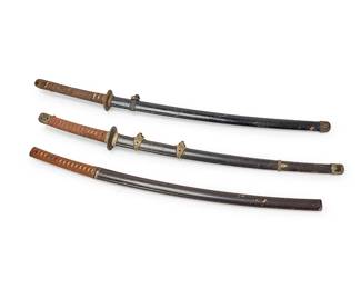 1402
20th century
Three Japanese katana swords
Each unsigned
Each with cord-wrapped menuki and housed in a lacquered wood saya, two mounted with gilt metal accents, 3 pieces
Longest blade: 25.5" L; Longest overall: 40.5" L
Estimate: $300 - $500