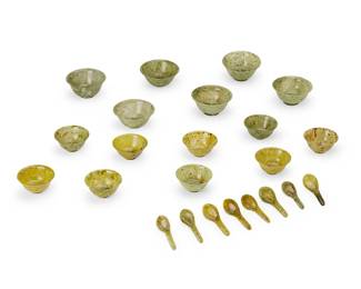 1377
20th century
A group of carved stone bowls and spoons
Comprising 6 nephrite footed bowls (5" Dia.), 9 serpentine smaller footed bowls (4" Dia.), and 8 serpentine Asian-style soup spoons (4.625" L), 23 pieces
Estimate: $200 - $400