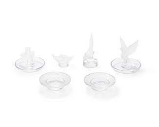 1348
Mid/late 20th century
A group of Lalique glass table items
Two etched: Lalique France; four etched: Lalique ® France [post-1978]
The molded glass items, each featuring frosted or figural avian motifs, comprising two ring trays with central bird figures, two small dishes, and two figural bird paperweights, 6 pieces
Largest: 4" H x 3.875" Dia.; Smallest: 1.5" H x 3" W x 1.25" D
Estimate: $200 - $400