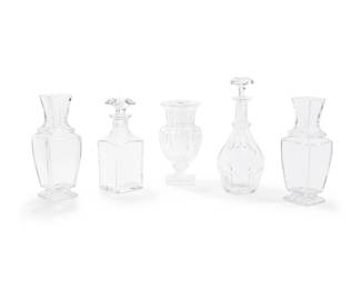 1341
Mid/late 20th century
A group of Baccarat glass vases and decanters
Each with Baccarat stencil mark; one vase additionally etched to underside: Musee des Cristalleries de Baccarat / 1821-1840 / Reproduction
Comprising a "Marie Louise" gadrooned flower vase, two "Pearl" flower vases, a "Harcourt" wine decanter with stopper, and a "Harcourt" whiskey decanter with stopper, 5 pieces
Tallest: 11.875" H x 4.75" Dia.; Shortest: 8.625" H x 4.5" Dia.
Estimate: $300 - $500