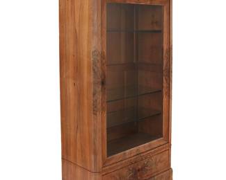 1493
Mid-19th century
A Louis Philippe walnut display cabinet
The veneered wood cabinet with hinged glazed locking door revealing four later glass shelves and two lights, above a single locking drawer, raised on bracket feet, electrified
70.25" H x 38" W x 18.75" D
Estimate: $400 - $600