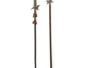 1475
17th century or later
Two Continental halberds
Comprising two wrought metal halberds with carved wood poles, one with woven fabric adornments at mounting juncture, 2 pieces
Longer: 90" L x 10" W; Shorter: 83" L x 8" W
Estimate: $400 - $600