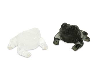 1343
Late 20th/early 21st century
Two Lalique glass "Gregoire" frog figures
Each etched to underside: Lalique ® France [post-1978]; the black with model number sticker: 11684; the clear with sticker applied: Made in France
Comprising two frosted glass frog figures, one black and one clear, 2 pieces
Each: 3" H x 4.625" W x 4.25" D
Estimate: $400 - $600