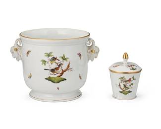 1359
Mid/late 20th century
Two Herend porcelain "Rothschild Bird" table items
Each marked in blue: Herend / Hungary / Handpainted; cache pot further marked: 7281; jar further marked: 8972 / RC / 57
Each decorated with painted birds and butterflies, with gilt accents, comprising a cache pot with opposed goat head handles in relief, and a lidded jar, 2 pieces
Cache: 8.5" H x 12.125" W x 9.5" D; Jar: 6.125" H x 4.5" Dia.
Estimate: $300 - $500