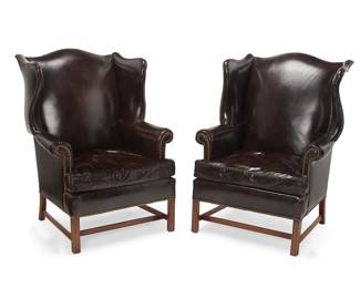 1477
Early 21st century
A pair of Hickory Chair Furniture Co. leather wingback chairs
Each with Hickory Chair tag under seat cushion
The George III-style wood chairs with oxblood leather upholstery and brass tacking raised on square legs joined by an anterior lateral stretcher, 2 pieces
Each: 43" H x 34" W x 34" D
Estimate: $500 - $700