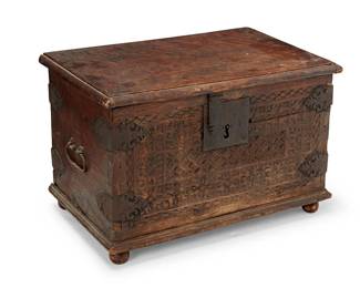 1487
19th century
A Spanish Baroque-style walnut trunk
The carved wood trunk with wrought metal mounted and hardware including opposed handles and latch lock for hinged top, revealing three brass bells, raised on bun feet
13.125" H x 20" W x 13" D
Estimate: $400 - $600