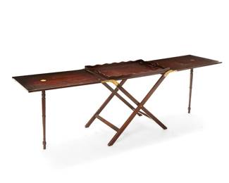 1480
Early 20th century
A Baker Furniture mahogany folding serving table
With metal tag to central console: Baker Furniture
The table with folding butterfly top featuring brass inlay accents, centering a removeable serving tray raised on a central X-form console issuing opposed extensions, each raised on screw-in turned legs
Open: 27.75" H x 89.25" W x 21.5" D
Estimate: $500 - $700