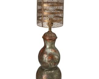 1500
Mid-20th century
A Modern copper table lamp
Unmarked
The single-light lamp assembled from a double gourd-form patinated metal base with stamped floral and foliate motifs, set on a wood platform, surmounted by a cylindrical metal shade with gold toned finish and pierced lattice pattern, electrified
Overall: 36" H x 8.5" Dia.
Estimate: $100 - $200