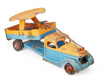 1434
1920s
A Buddy L "Rider Dump Truck" toy
Decal to each side: Rider / Buddy L / Dump Truck; further stamped in the metal: Buddy L
The painted pressed steel ride-on toy with steering mechanism, articulated plastic wheels, and swiveling dump body with mounted seat
7.875" H x 20.5" W x 8.5" D
Estimate: $100 - $200