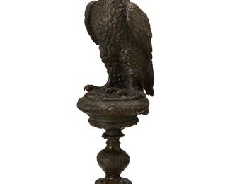 1370
20th century
A Continental bronze eagle figure
Unmarked
The patinated bronze bird figure depicted perched on a stand with rockwork, scrolled motifs, and a gadrooned base
Overall: 16.625" H x 6.75" W x 5.375" D
Estimate: $400 - $600