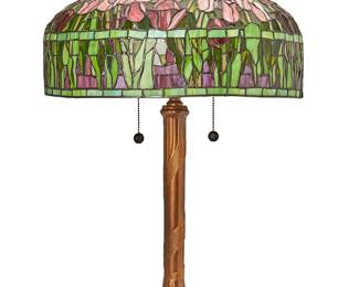 1435
Late 20th century
A Tiffany-style leaded glass lamp
Base with sticker: Dale Tiffany
The two-light lamp with leaded glass vase in the style of L.C. Tiffany, mounted to a patinated metal base, electrified
Lamp: 28" H x 10" Dia.; Shade: 10.5" H x 18.25" Dia.
Estimate: $400 - $600