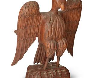 1438
20th century
A Folk art carved wood eagle bookstand
Unmarked
The lectern/book stand depicting an eagle with wings spread and a shelf verso
20.25" H x 16.375" W x 8.5" D
Estimate: $100 - $200