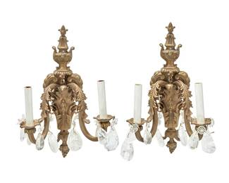 1472
Early 20th century
A pair of Louis XVI-style gilt-bronze sconces
The two-light converted sconces, each wall mount with acanthus leaf and bellflower accents issuing two arms, each terminating in a floriform bobèche mounted with rock crystal teardrops, electrified, 2 pieces
Each: 18" H x 11" X x 8" D approximately
Estimate: $200 - $400