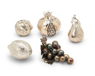 1318
Mid/late 20th century
A Buccellati sterling silver bunch of grapes and other fruit items
Each marked: 925; grapes additionally marked: M Buccellati / [star] 14 / [illegible]; others variously numbered and marked: AN
Comprising a sterling silver Buccellati bunch of grapes and four weighted silver fruits including a lemon, a pear, an apple, and a pomegranate, 5 pieces
Grapes: 2.5" H x 5.25" W x 3.5" D; Pomegranate: 3.125" H x 3.125" Dia.
Weighable sterling: 2.5 oz. troy approximately
Estimate: $400 - $600