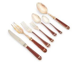 1337
Late 20th/early 21st century
A Christofle "Talisman" lacquer flatware service
Each marked: Christofle / France
The silver-plate and sienna brown Laque de Chine service comprising 8 dinner forks (8.125"), 8 salad forks (6.75"), 8 oval soup spoons (7.625"), 8 teaspoons (6"), 8 dinner knives (9.75"), a serving fork (9.875"), and a serving spoon (9.875"), each housed in original packaging, 42 pieces
Estimate: $2,000 - $4,000