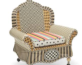 1461
Early 21st century
A Mackenzie-Childs "Queen Bee Courtyard Outdoor Wing Chair"
With metal plaque verso: Mackenzie-Childs / [logo]; seat cushion with Mackenzie-Childs tag
The resin wicker armchair with checkered diamond motif back below a scrolled finial above rolled armrests, raised on shaped feet, the Sunbrella upholstered cushion with twisted black and white cording
50.5" H x 39" W x 34.5" D
Estimate: $400 - $600