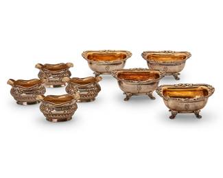 1328
19th century
A group of British sterling silver salt cellars
Each marked for sterling; the larger marked for Dublin, date marked for 1814, with George III duty mark, and with maker's mark: I S [James Scott]; the smaller marked for Sheffield, dated marked for 1893, and with maker's mark: H A [Atkin Brothers]; the larger further marked with family crest: Aymez Louyalte [Love Loyalty] / P [Paulet]
Each with gold-washed interior, comprising four larger sterling cellars, each with ornate egg and dart and foliate motif rim and raised on paw feet, and four smaller sterling footed cellars, each with repoussé foliate and floral motifs, the larger personalized, 8 pieces
Each larger: 2" H x 4" W x 3.25" D; Each smaller: 1.625" H x 3" W x 1.875" D
17.1 oz. troy approximately
Estimate: $300 - $500