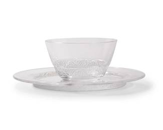 1349
Late 20th/early 21st century
A group of Lalique glass "Phalsbourg" dinner service items
Each etched to underside: Lalique ® France [post-1978]
Designed 1924
The glass dinner service items, each with frosted glass grapevine motifs, comprising 12 luncheon plates (8.625") and 8 bowls (4.75"), 18 pieces
Estimate: $200 - $300