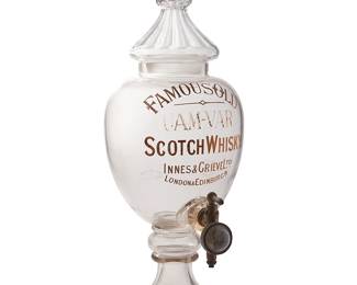 1436
20th century
A J.A. Cox Innes & Grieve "Uam Var" scotch whisky dispenser
Etched and painted: Famous Old / Uam-Var / Scotch Whiskey / Innes & Grieve Ltd. / London & Edinburgh and stenciled mark for J.A.Cox Soho London and registry mark 097380
The lidded urn form glass vessel with metal spout dispenser
Overall: 30" H x 10" W x 13.75" D
Estimate: $300 - $500