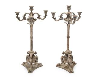 1361
Late 19th/early 20th century
A pair of Elkington & Co. silver-plated candelabra
Each marked to underside: Published By Elkington & Co. / 482
The four-light candelabra, each issuing three foliate-form arms above a columnar standard, the base with figural griffins with paw feet alternating with anthemion leaves and ivy, set on a tripod base, 2 pieces
Each: 25.25" H x 12.5" W x 11.75" D
Estimate: $600 - $800