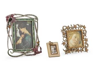 1352
Early 21st century
Three Jay Strongwater jeweled enamel photograph frames
Each marked for Jay Strongwater
Each metal frame mounted with cut glass jewels and with easel back, comprising one with openwork, floral motif, and bee figures to frame, another with crescent moon and stars, and a diminutive frame with a butterfly figure, 3 pieces
Largest: 6.25" H x 5.25" W x 1.75" D; Smallest: 2.375" H x 1.75" W x 0.5" D
Estimate: $300 - $500