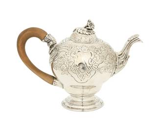 1325
1829
An English sterling silver teapot
With hallmarks for London and for sterling; dated marked for 1829; maker's mark for James Wintle: IW
The silver teapot with chased and repoussé floral motifs, featuring a floriform finial to hinged lid, a foliate-form spout, and a carved wood handle, raised on a tiered foot
5.625" H x 8" W x 4.375" D
13.7 gross oz. troy approximately
Estimate: $400 - $600