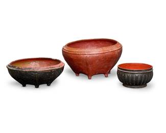 1403
Late 19th/early 20th century
Three Burmese lacquerware baskets
The red and black lacquered vessels, comprising two larger woven basketry vessels raised on feet, and one with vertically indented body above a circular base, 3 pieces
Largest: 10.25" H x 18.5" Dia. approx.; Smallest: 5.5" H x 10" Dia. approx.
Estimate: $600 - $800