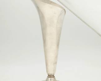 1317
Circa 1956-1965, directorship of William T. Lusk
A Tiffany & Co. sterling silver "Calla Lily" vase
Marked to underside: Tiffany & Co Makers / Sterling Silver / 23425 / L
The silver vase in the form of a calla lily raised on a flat tulip base
12.125" H x 6.625" W x 4.75" D
17.7 oz. troy approximately
Estimate: $500 - $800