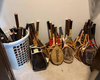 Numerous vintage wood racquets. Also a signed wood raquet from Chris Everet.