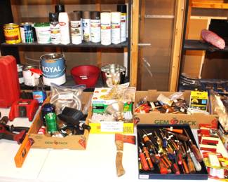 Variety of tools, screw drivers, paints.